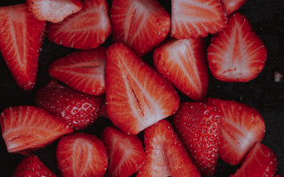Sliced strawberries table plate knife - top of a table next free wallpaper