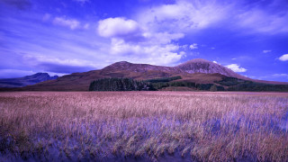 Mountain field city sky clouds - rich moody colour free wallpaper