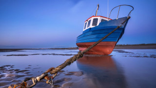 Boat rope beach sky ocean - a blue sky in the background free wallpaper for desktop