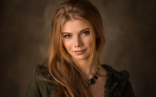Woman longhair greenjacket portrait brownbackground - a green jacket free wallpaper