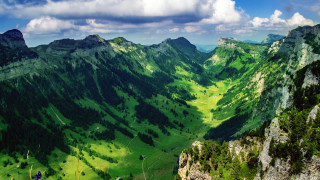 Valley mountains clouds sky view - a view of a valley free wallpaper