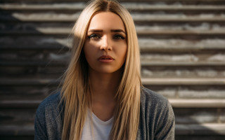 Woman blonde hair serious look 2 - neoplasticism free wallpaper