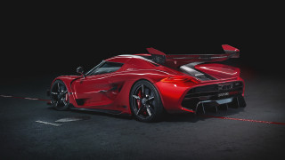 Red sports car dark room 58 - side profile free wallpaper