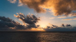 Sunset ocean clouds boat horizon 4 - the sky and a boat free wallpaper