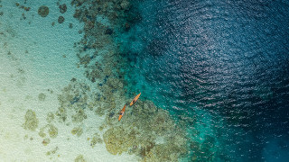 Boat beach rocks ocean night - the water near a beach free wallpaper