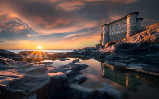 Rocky beach building sunset ocean - the cloud free wallpaper