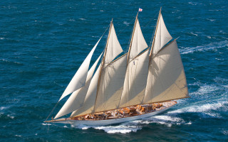 Sailboat ocean people beach dock - a sailboat free wallpaper
