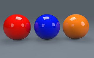 Three balls orange blue red - a gray background free wallpaper