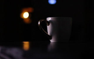 White coffee cup dark room - a light bulb free wallpaper