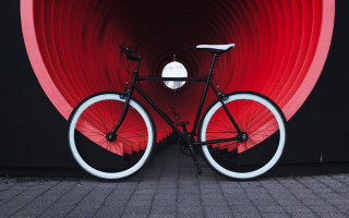 Bicycle red wall circular window - a red wall free wallpaper