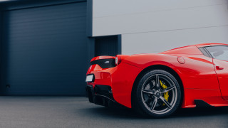 Red sports car garage door - side profile free wallpaper