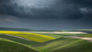 Green field road stormy sky - a dark sky above free wallpaper