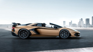 Gold sports car city skyline - a city skyline in the background free wallpaper