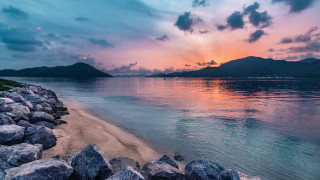 Beach rocks water sunset mountains - cloudy free wallpaper