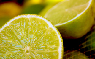 Lemon lime closeup green photorealism - a table top free wallpaper