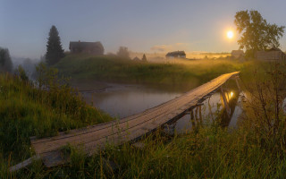 Wooden bridge river foggy field - a house in the distance free wallpaper