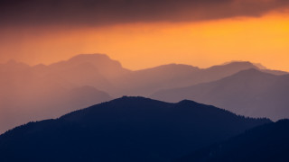 Mountain range sunset clouds orange - a sunset in the background free wallpaper