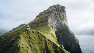 Lighthouse grassy hill ocean mountain - naturalism free wallpaper
