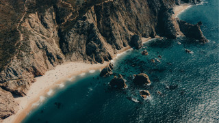 Beach cliff water sky moon - sandy free wallpaper