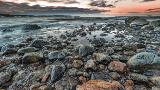 Rocky beach sunset clouds shore - rock and water free wallpaper
