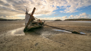 Boat beach sky clouds water - sandy free wallpaper