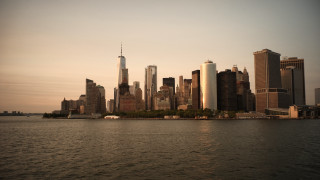 Cityscape boat sunset bridge castle - a boat in the foreground free wallpaper