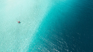 Boat water person ocean night - a boat floating free wallpaper