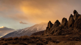 Snowy mountains clouds bushes dusk - dramatic light free wallpaper
