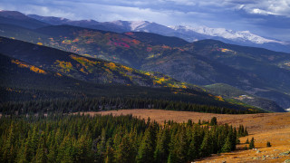 Mountain range trees water city - the foreground and a body of water free wallpaper