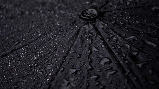 Black umbrella waterdrops whiteborder photorealism - a white border free wallpaper