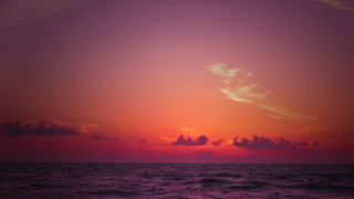 Sunset ocean plane clouds city - a sunset over the ocean free wallpaper
