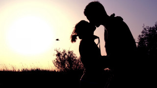 Man woman kissing sunset bird - a sunset free wallpaper