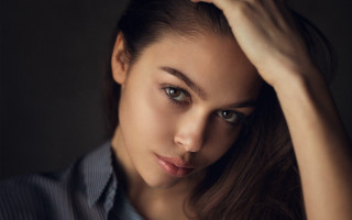 Woman blue shirt black background - free portrait wallpaper