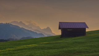 Small cabin grassy hill mountains - sunset free wallpaper