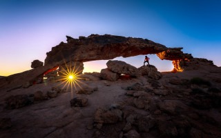 Person rock formation sunset arch - a rock formation free wallpaper for desktop