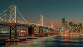 Bridge cityscape night lights water - a bridge over a body of water free wallpaper