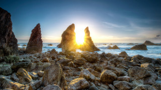 Rocky beach sunset water bridge - the foreground and a body of water free wallpaper