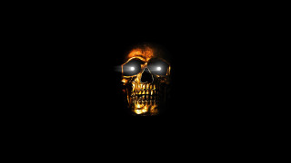 Skull glowing eyes black background - a skull free wallpaper