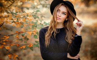 Woman black hat sweater autumn - yellow leaf free wallpaper