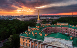 Sunset building green roof spire - colorful cloud free wallpaper