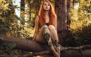 Red haired woman tattoo forest - her arm and legs free wallpaper