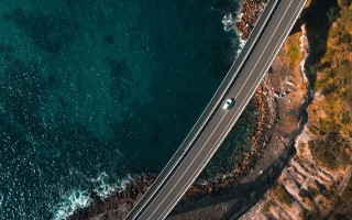Ocean cliff road car cinematic - a road next free wallpaper