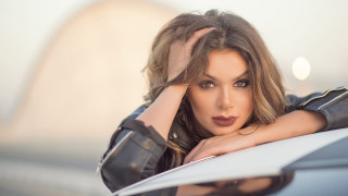 Woman leaning on car armor - portrait photography free wallpaper for desktop