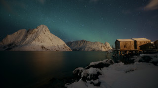 Snowy shore night sky mountains - a mountain range in the background free wallpaper