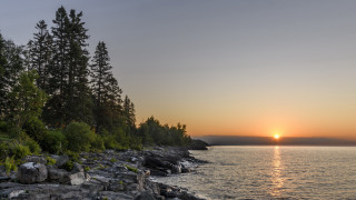 Sunset lake trees rocks water - a sunset over a lake free wallpaper