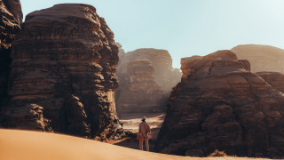 Desert man rocks sand sky - a sky background free wallpaper for desktop