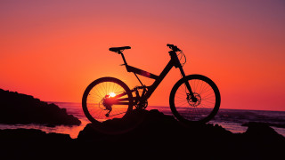 Bike rock sunset ocean person - the rock free wallpaper