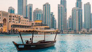Boat people city skyline water - tall building free wallpaper