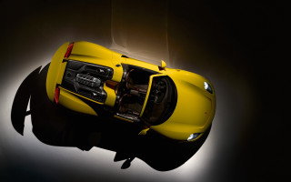 Yellow sports car above dark - f 8 aperture free wallpaper