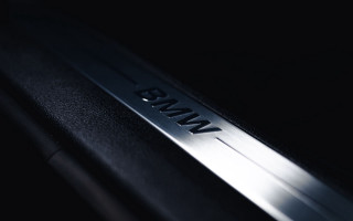 Metal nameplate black surface white - a white light free wallpaper